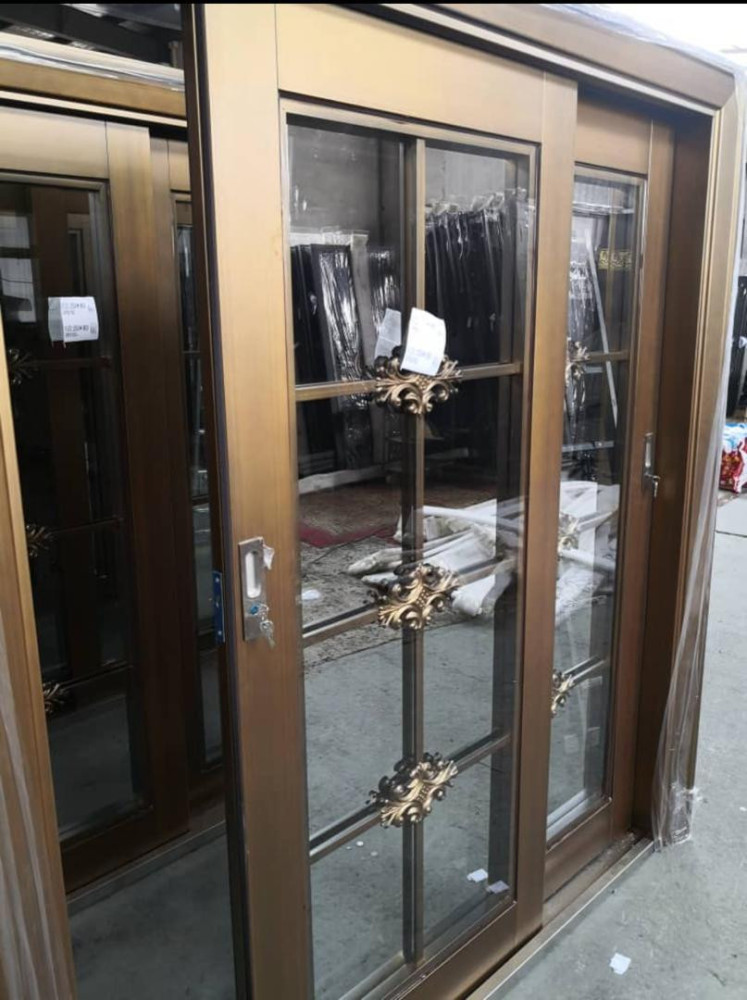 Turkish Security Door with a glass panel and decorative metal accents