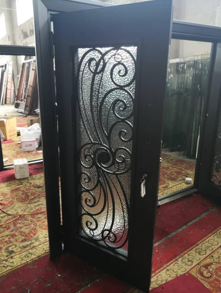 This is a single wrought Iron entry door with a decorative glass panel
