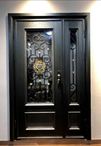 Black wrought iron security door with glass panels