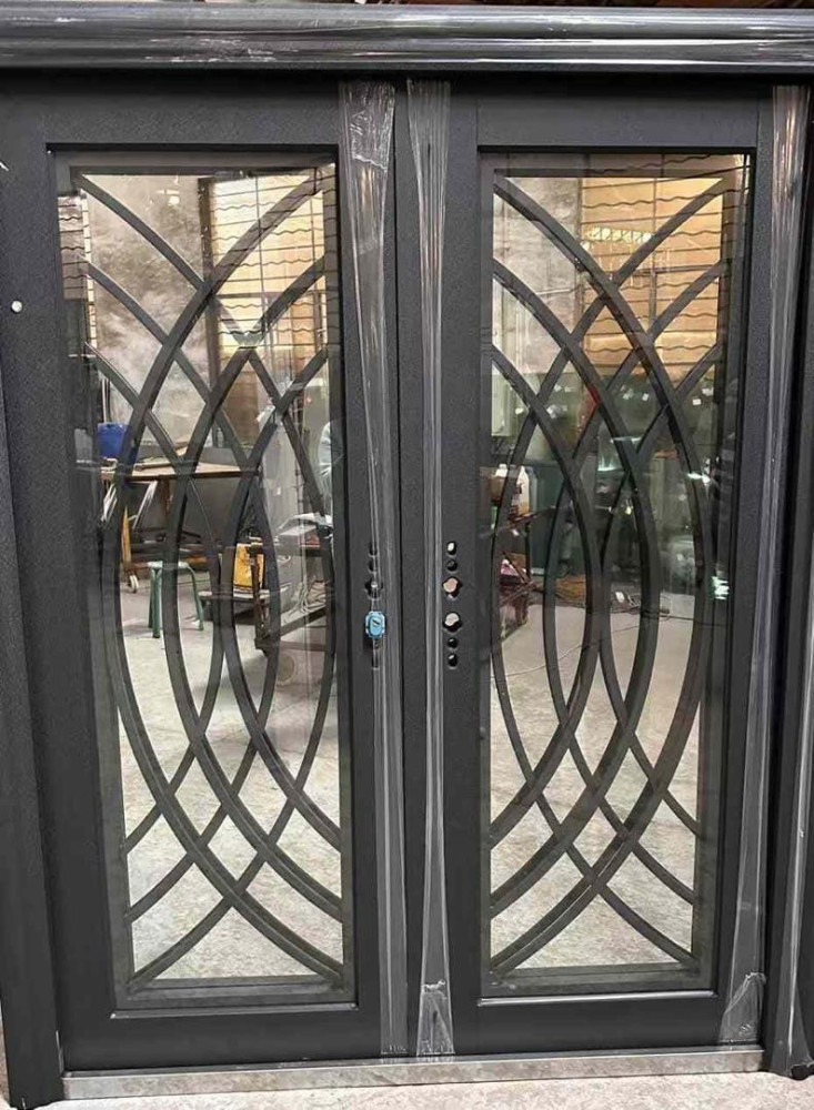 Modern black wrought Iron double entry door with an intricate geometric design