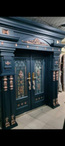 an Arch and Piller Security Copper Door