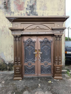 Double copper cast security door with an architrave