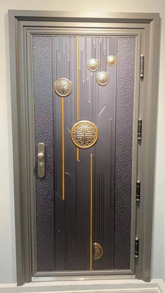 Modern Steel Security door with a black finish and gold accents