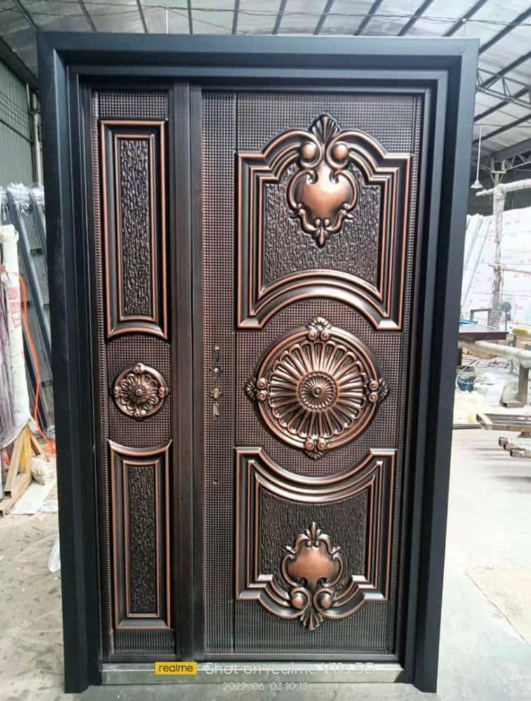 High-qaulity cast Steel Security Door, likely a double door design with a copper or bronze finish