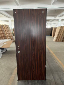 Brown Isreali Security Door likely made of steel with a wood finish 