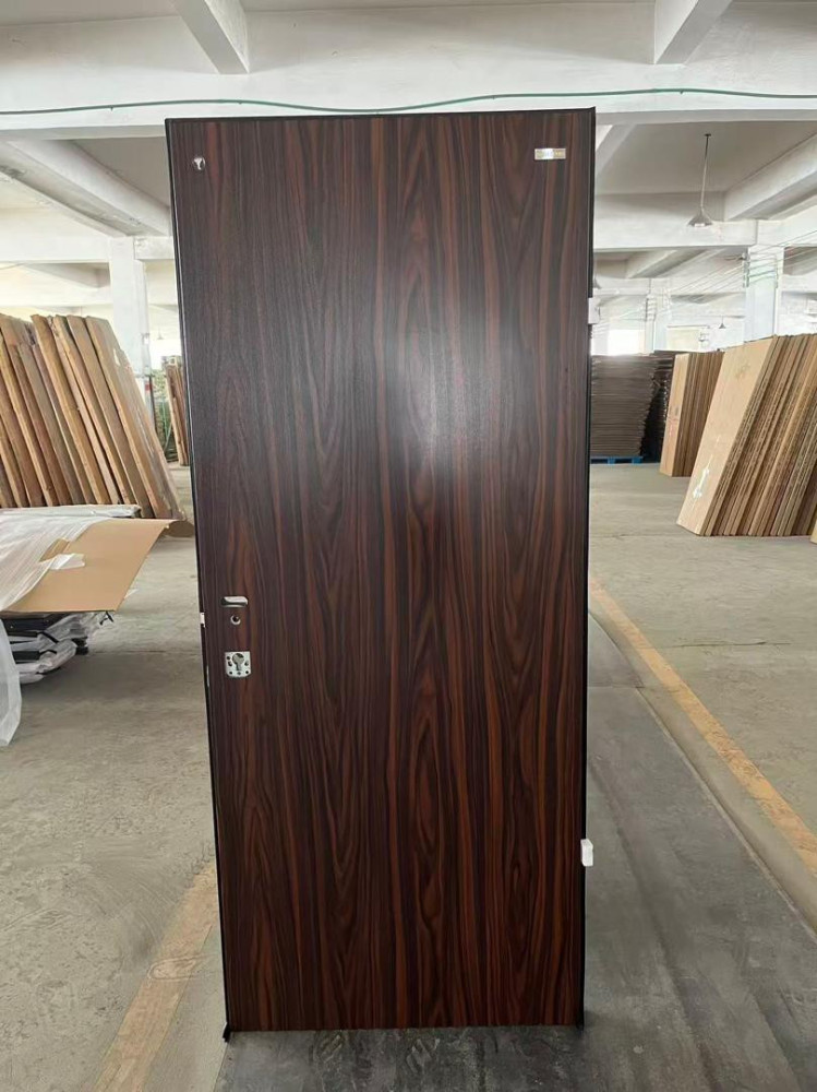 Brown Isreali Security Door likely made of steel with a wood finish 