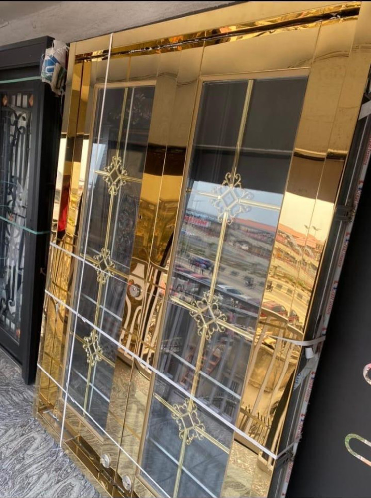 Gold glass swing door