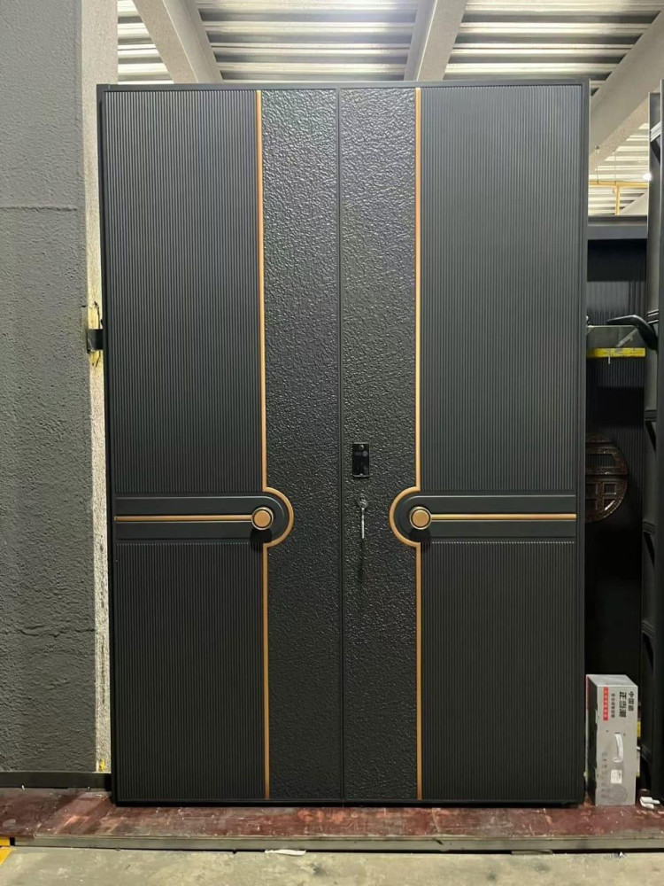Modern cast aluminum villa security door featuring a decorative textured finish and gold accent lines